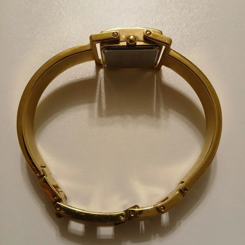 VTG 90s Joan Rivers Classics Gold Tone MOP Dial Quartz Bangle Women's Watch 19mm
